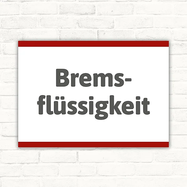Schild mit dem Motivtext Bremsflüssigkeit