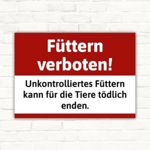 Schild mit dem Text Füttern verboten! Unkontrolliertes Füttern kann für die Tiere tödlich enden.