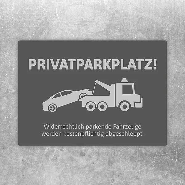 Grauer Aufkleber mit Privatparkplatz-Hinweis und Abschlepper für reservierte Stellflächen.