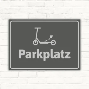 Grauer Schild mit E-Scooter-Symbol und dem Hinweis Parkplatzzone für den Abstellbereich.