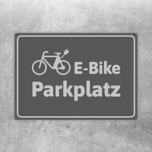 Grauer Aufkleber mit Fahrradsymbol und dem Text E-Bike-Parkplatz für Stellflächen