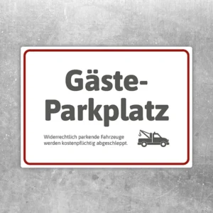 Aufkleber mit dem Hinweis Gästeparkplatz und Abschleppsymbol für reservierte Stellflächen.