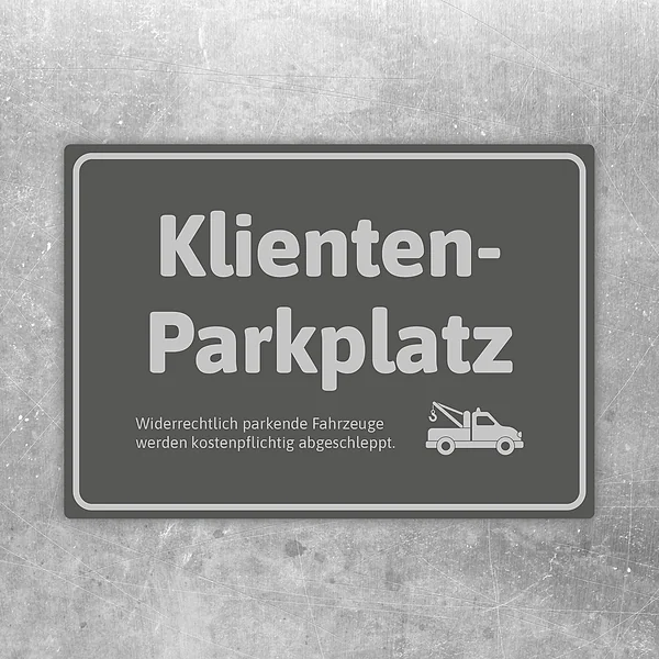 Grauer Aufkleber mit Text Klientenparkplatz und Abschlepper-Symbol für reservierte Stellflächen.