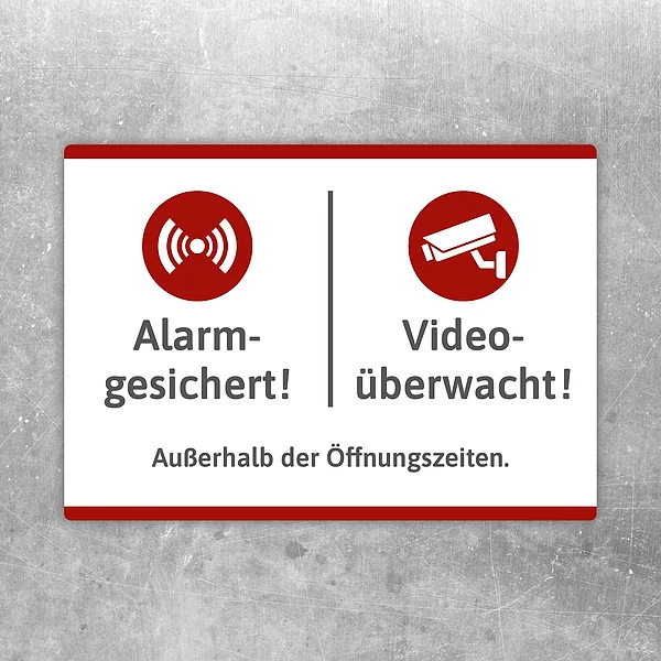 Aufkleber mit den Hinweisen alarmgesichert und videoüberwacht außerhalb der Öffnungszeiten.