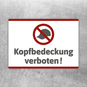 Aufkleber mit durchgestrichener Kopfbedeckung und dem Hinweis Kopfbedeckung verboten.
