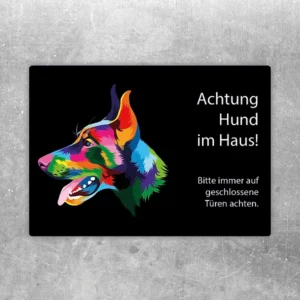 Aufkleber mit farbigem Dobermann und dem Hinweis Achtung Hund im Haus.