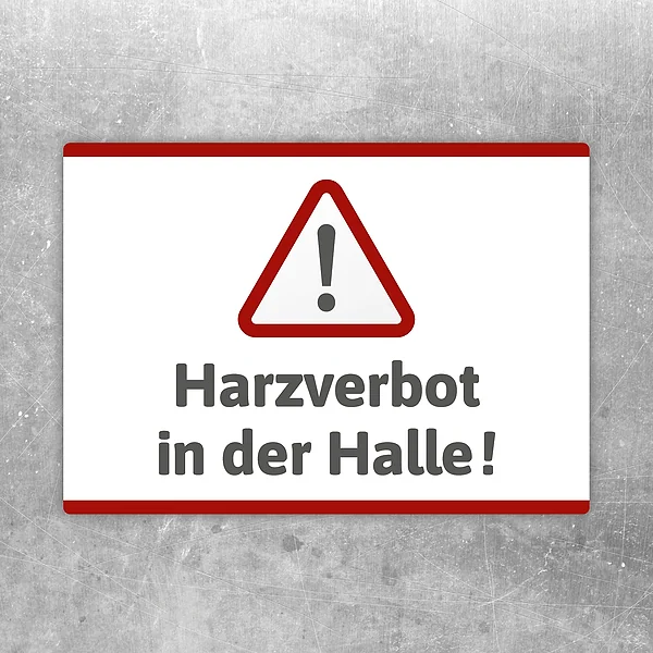 Aufkleber mit Warnsymbol und dem Hinweis Harzverbot in der Halle