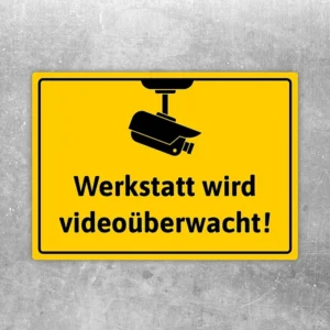 Aufkleber mit Kamera Symbol und dem Hinweis Werkstatt wird videoüberwacht.