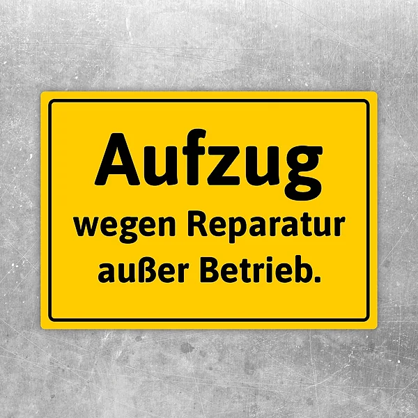 Aufkleber mit dem Hinweis: Aufzug wegen Reparatur außer Betrieb an einer Tür