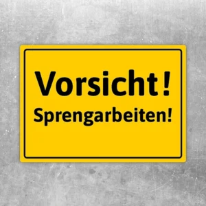 Gelber Vorsicht Sprengarbeiten Aufkleber mit schwarzer Warnschrift für Baustellen und Gefahrenbereiche.
