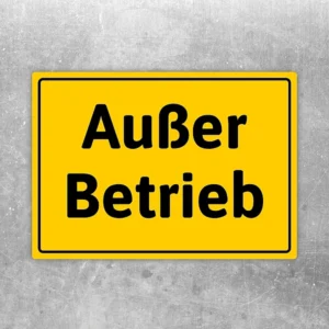Gelber Aufkleber mit der Aufschrift Außer Betrieb als klarer Hinweis für gesperrte Bereiche.