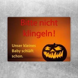 Halloween Aufkleber mit Hinweis „Bitte nicht klingeln, Baby schläft schon“ an der Haustür.