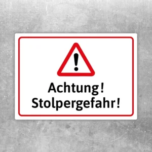 Warnaufkleber mit Dreiecksymbol und Text Achtung Stolpergefahr in Rot und Schwarz.
