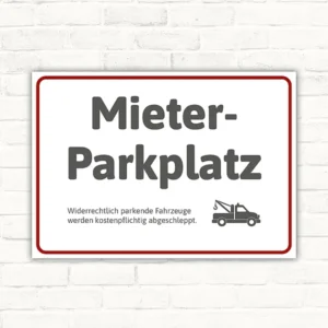 Schild mit Hinweis Mieterparkplatz und Abschleppsymbol für reservierte Stellflächen.