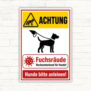 Warnschild mit Fuchsräude-Hinweis, Hund an der Leine und dem Text „Hunde bitte anleinen!“ als bedrucktes Schild.