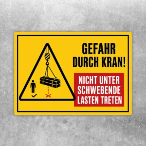 Warnschild Gefahr durch Kran! Nicht unter schwebende Lasten treten Aufkleber in Gelb, Schwarz und Rot mit Warnsymbol.