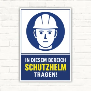 Schutzhelm tragen Schild mit Helm-Piktogramm und Text „In diesem Bereich Schutzhelm tragen!“ als Hinweisschild.
