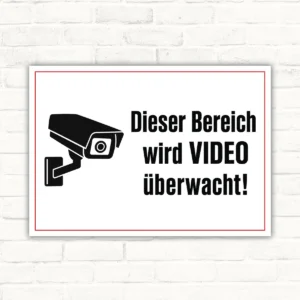 Videoüberwachung Schild mit Kamera-Icon und dem Text „Dieser Bereich wird überwacht“ als Querformat-Schild.