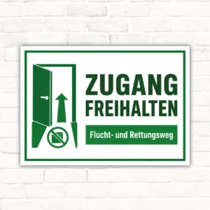 Zugang freihalten Schild mit Türsymbol und Pfeil für Flucht- und Rettungsweg, grünes Hinweisschild aus Aluminium-Verbundplatte.