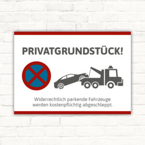 Schild Privatparkplatz mit Abschlepper