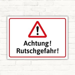 Warnschild mit rotem Warndreieck und dem Text Achtung Rutschgefahr