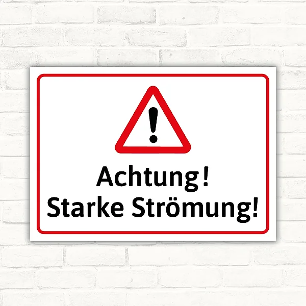Warnschild mit dem Text Achtung! Starke Strömung! in Rot, Schwarz und Weiß