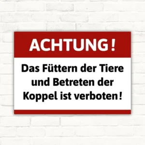 Füttern verboten Schild mit dem Text: Achtung! Das Füttern der Tiere und Betreten der Koppel ist verboten.