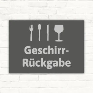 Schild mit Besteck-, Messer- und Glas-Symbol sowie der Aufschrift Geschirr-Rückgabe