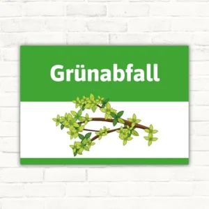 Schild mit der Aufschrift Grünabfall und einem Zweig mit grünen Blättern
