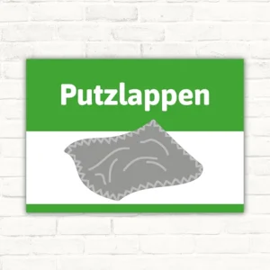 Schild mit der Aufschrift Putzlappen und grauem Putzlappen-Motiv auf grün-weißem Hintergrund