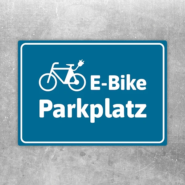 Aufkleber E-Bike-Parkplatz blau mit Fahrradpiktogramm für klar gekennzeichnete Stellflächen.