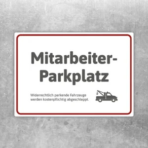 Aufkleber mit Mitarbeiterparkplatz und Abschlepper-Symbol als klarer Hinweis für reservierte Stellflächen.