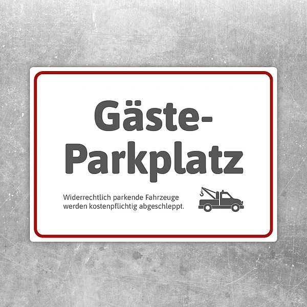 Aufkleber mit dem Hinweis Gästeparkplatz und Abschleppsymbol für reservierte Stellflächen.