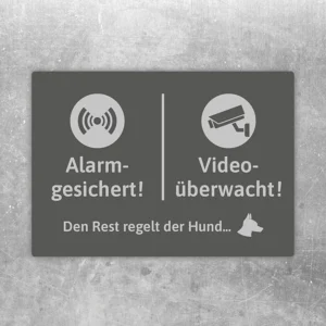 Aufkleber mit Hundemotiv und den Hinweisen alarmgesichert und videoüberwacht.