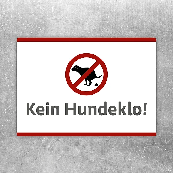 Aufkleber mit rotem Verbotssymbol und dem Hinweis „Kein Hundeklo“ für klare Bereiche.