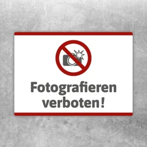 Aufkleber mit durchgestrichener Kamera und dem Hinweis Fotografieren verboten.