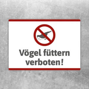 Aufkleber mit durchgestrichenem Vogel und dem Hinweis Vögel füttern verboten.