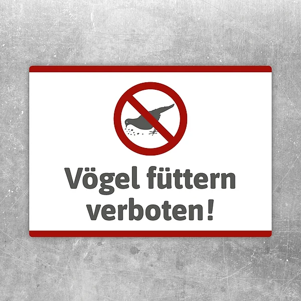 Aufkleber mit durchgestrichenem Vogel und dem Hinweis Vögel füttern verboten.