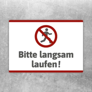 Aufkleber mit Symbol und Text „Bitte langsam laufen!“ für klare Hinweise im Eingangsbereich.