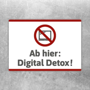 Aufkleber Ab hier Digital Detox mit durchgestrichenem Display als Hinweis auf handyfreie Bereiche.