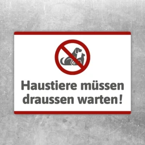 Aufkleber mit durchgestrichenem Haustier und dem Hinweis: Haustiere müssen draußen warten.