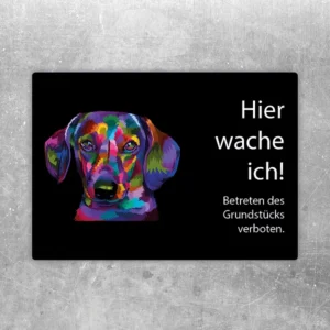 Aufkleber mit buntem Dackel und dem Text Hier wache ich für Haus oder Garten.