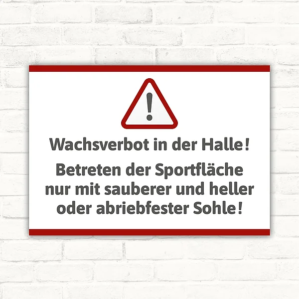 Schild mit Warnsymbol und Text zum Wachsverbot in der Halle für Sportflächen.