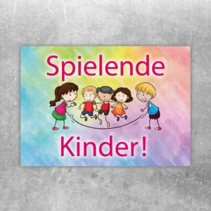 Aufkleber mit dem Hinweis „Achtung spielende Kinder“ und kindgerechtem Motiv.