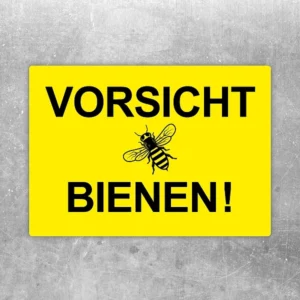 Aufkleber mit dem Hinweis Vorsicht Bienen und einer Biene in der Mitte.