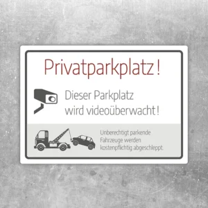 Aufkleber mit Hinweis auf Privatparkplatz, Videoüberwachung und kostenpflichtiges Abschleppen.