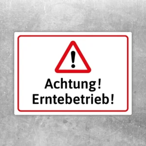 Aufkleber mit Warnsymbol und Text „Achtung! Erntebetrieb!“ für landwirtschaftliche Bereiche.