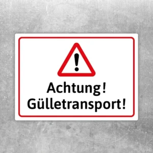 Warnaufkleber mit rotem Dreieck und dem Text Achtung Gülletransport für landwirtschaftliche Fahrzeuge.