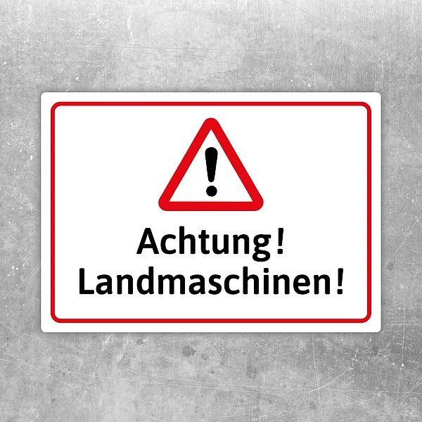 Warnaufkleber mit rotem Dreieck und dem Text „Achtung! Landmaschinen!“