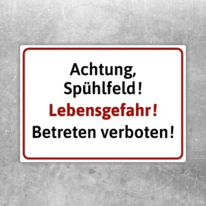 Warnaufkleber mit dem Text Achtung Spülfeld Lebensgefahr Betreten verboten